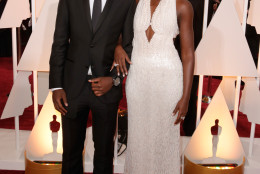 Peter Nyong'o, left, and Lupita Nyong'o arrive at the Oscars on Sunday, Feb. 22, 2015, at the Dolby Theatre in Los Angeles. (Photo by Todd Williamson/Invision/AP)
