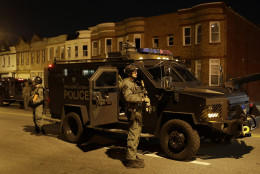 Prince George's County Police enforce curfew, Tuesday, April 28, 2015, in Baltimore, a day after unrest that occurred following Freddie Gray's funeral. (AP Photo/Patrick Semansky)
