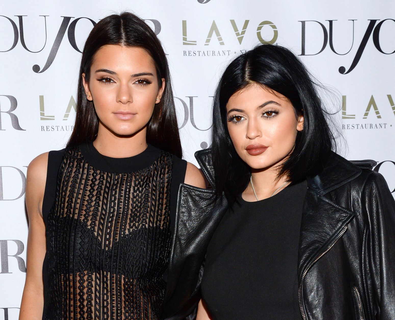 FILE - In this Aug. 28, 2014 file photo, Kendall Jenner, left, and Kylie Jenner celebrate DuJour's Fall Issue in New York. The mobile video game developer responsible for the popular Kim Kardashian: Hollywood game announced plans Tuesday, March 17, 2015, to develop a title starring Kardashian half-sisters Kendall and Kylie Jenner. (Photo by Evan Agostini/Invision/AP, File)