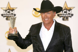 George Strait poses in the press room with the milestone award at the 50th annual Academy of Country Music Awards at AT&amp;T Stadium on Sunday, April 19, 2015, in Arlington, Texas. (Photo by Jack Plunkett/Invision/AP)