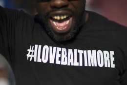 A message reading "I Love Baltimore" is written across a T-Shirt worn by Rashid Scott as he marches with protesters toward City Hall to demonstrate the police-custody death of Freddie Gray, Thursday, April 30, 2015, in Baltimore. (AP Photo/David Goldman)