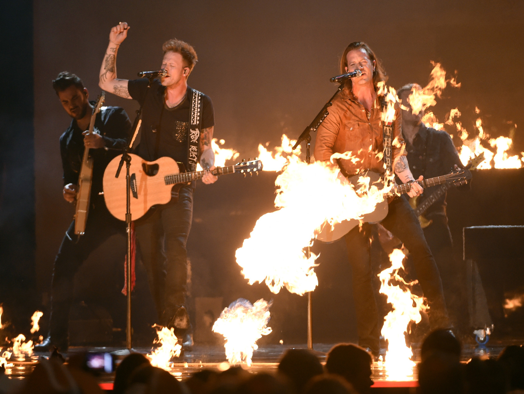 Brian Kelley, left, and Tyler Hubbard, of Florida Georgia Line, perform at the 50th annual Academy of Country Music Awards at AT&amp;T Stadium on Sunday, April 19, 2015, in Arlington, Texas. (Photo by Chris Pizzello/Invision/AP)