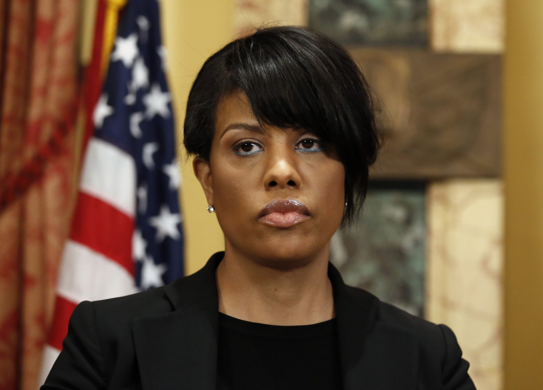 Mayor Stephanie Rawlings-Blake prepares to speak at a media availability at City Hall, Friday, May 1, 2015 in Baltimore.  Rawlings-Blake says five of six officers charged in the death of Freddie Gray are in custody. State's Attorney Marilyn J. Mosby announced criminal charges Friday against all six officers. (AP Photo/Alex Brandon)