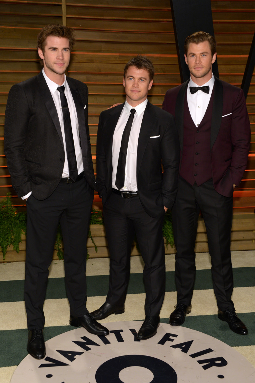 From left, Liam Hemsworth, Luke Hemsworth and Chris Hemsworth attend the 2014 Vanity Fair Oscar Party, on Sunday, March 2, 2014, in West Hollywood, Calif. (Photo by Evan Agostini/Invision/AP)