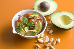 This June 2, 2014 photo shows tomato and avocado salad with gingered tomato vinaigrette and toasted peanuts in Concord, N.H. (AP Photo/Matthew Mead)