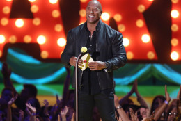 Dwayne Johnson presents the award for movie of the year at the MTV Movie Awards at the Nokia Theatre on Sunday, April 12, 2015, in Los Angeles. (Photo by Matt Sayles/Invision/AP)