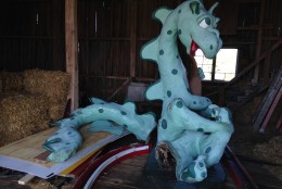 The friendly-looking dragon from the theme park's entrance was recently moved to a barn at nearby Clark's Elioak Farm. The dragon will be repaired and repainted for future display. (WTOP/Michelle Basch)