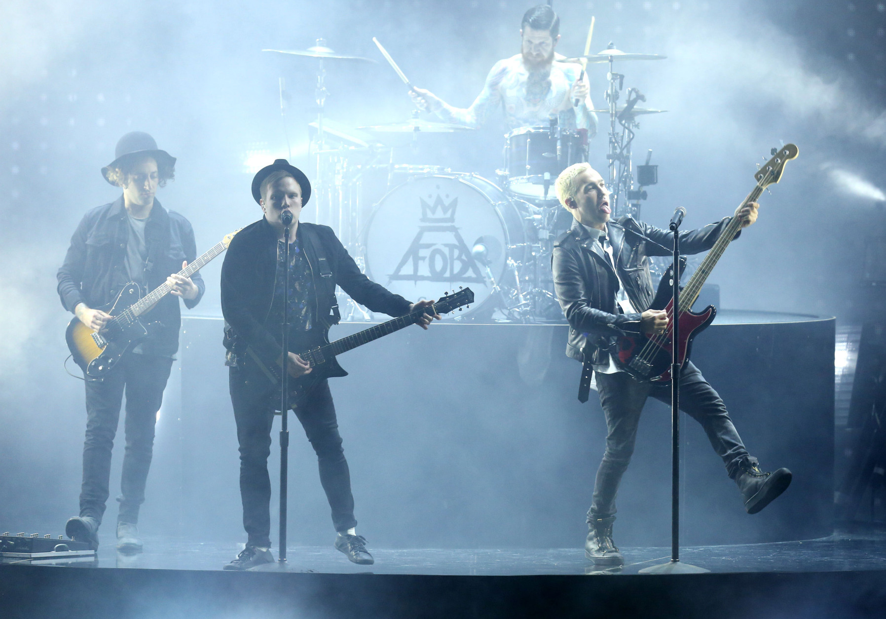 Joe Trohman, from left, Patrick Stump, Andy Hurley, on drums, and Pete Wentz of Fall Out Boy perform at the MTV Movie Awards at the Nokia Theatre on Sunday, April 12, 2015, in Los Angeles. (Photo by Matt Sayles/Invision/AP)