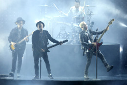 Joe Trohman, from left, Patrick Stump, Andy Hurley, on drums, and Pete Wentz of Fall Out Boy perform at the MTV Movie Awards at the Nokia Theatre on Sunday, April 12, 2015, in Los Angeles. (Photo by Matt Sayles/Invision/AP)