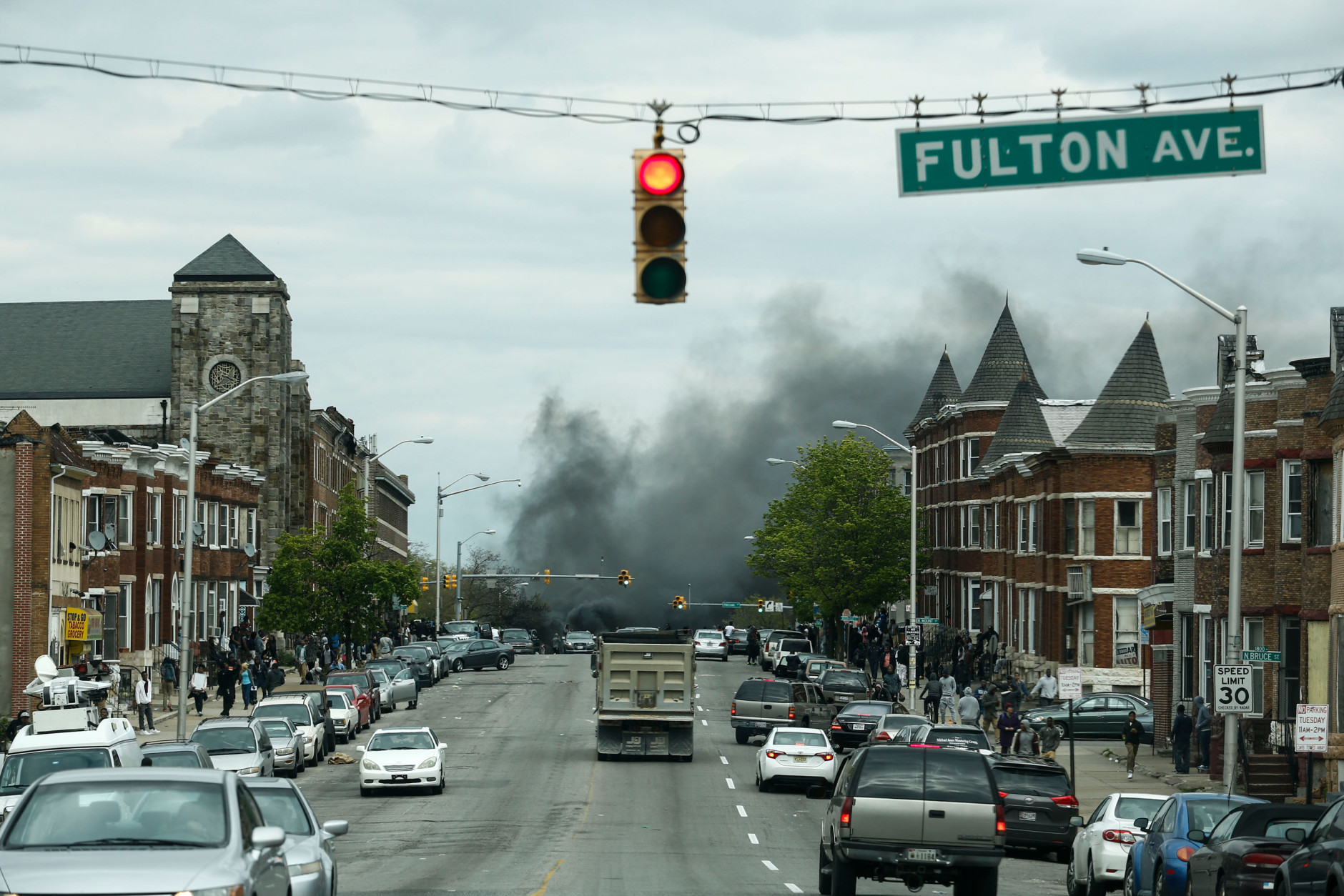 BALTIMORE, MD - APRIL 27: Smoke billows at the intersection of Pennsylvania Avenue and North Avenue (seen from Fulton Ave), April 27, 2015 in Baltimore, Maryland. Riots have erupted in Baltimore following the funeral service for Freddie Gray, who died last week while in Baltimore Police custody. (Photo by Drew Angerer/Getty Images)