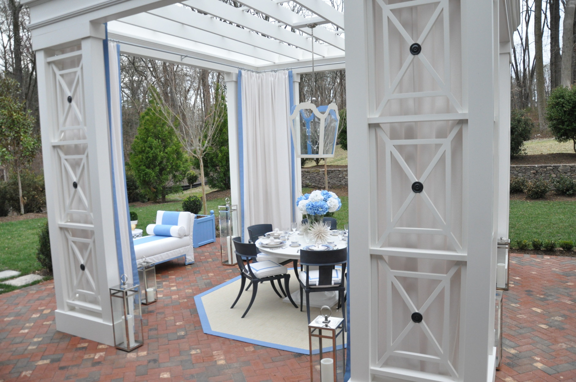 The blue and white color palette of the outdoor patio complements the natural greens of the outdoors, Sroka says. (WTOP/Rachel Nania) 