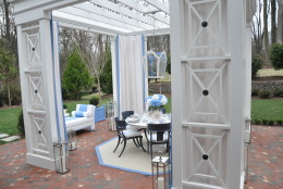The blue and white color palette of the outdoor patio complements the natural greens of the outdoors, Sroka says. (WTOP/Rachel Nania) 