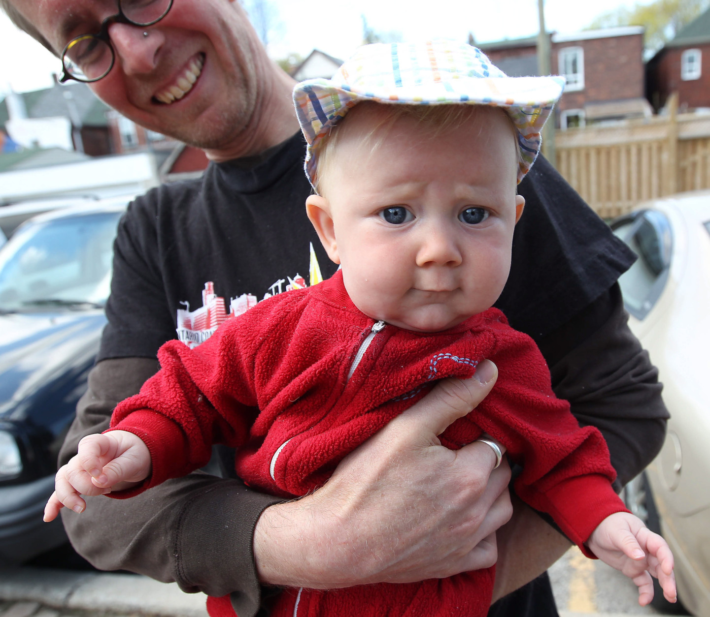 This May 7, 2011 photo shows David Stocker holding his 4-month-old child, Storm, in Toronto. Storm's parents, Kathy Witterick, 38, and Stocker, 39, of Toronto, have chosen to keep the gender of Storm a secret. They have shared Storms's gender only with their sons Jazz, 5, and Kio, 2, a close family friend and two midwives who helped deliver the baby.   (AP Photo/THE CANADIAN PRESS/Toronto Star, Steve Russell)