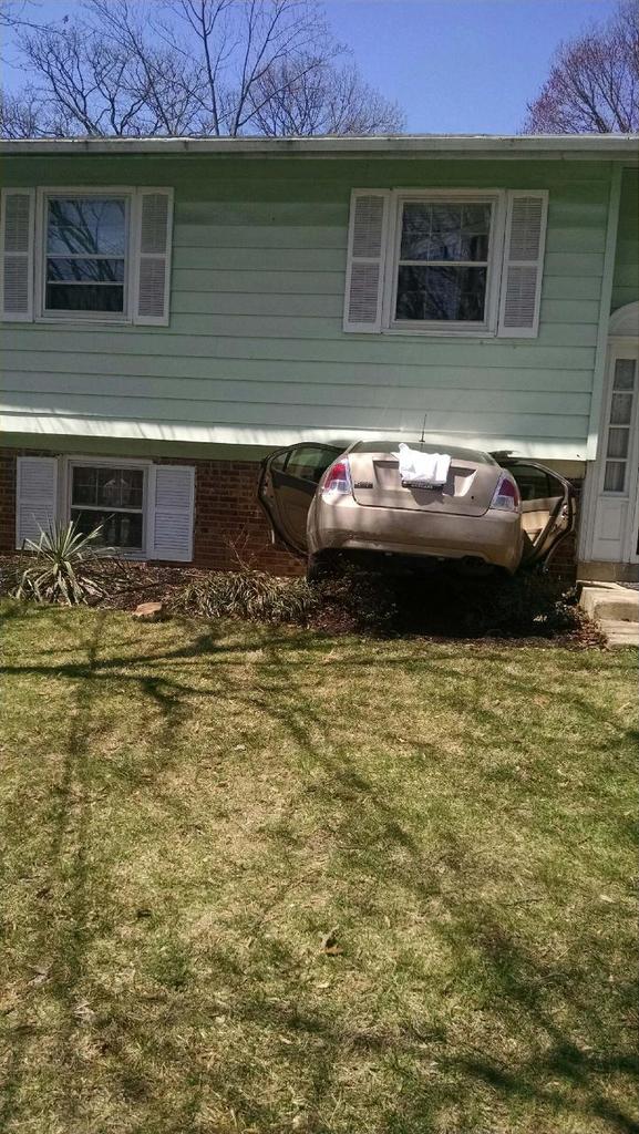 The driver is OK after the car he was driving went into this Lanham home. (PGFD)