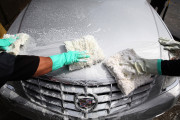 SAN FRANCISCO, CA - MARCH 20:  Workers at Divisadero Touchless Car Wash apply soap to a Cadillac on March 20, 2015 in San Francisco, California. As California enters its fourth year of severe drought, commercial car washes could potentially face water use restrictions even though most currently recycle a large portion of their water. Home car washing using a hose without a nozzle that automatically shuts off is currently banned in the state.  (Photo by Justin Sullivan/Getty Images)