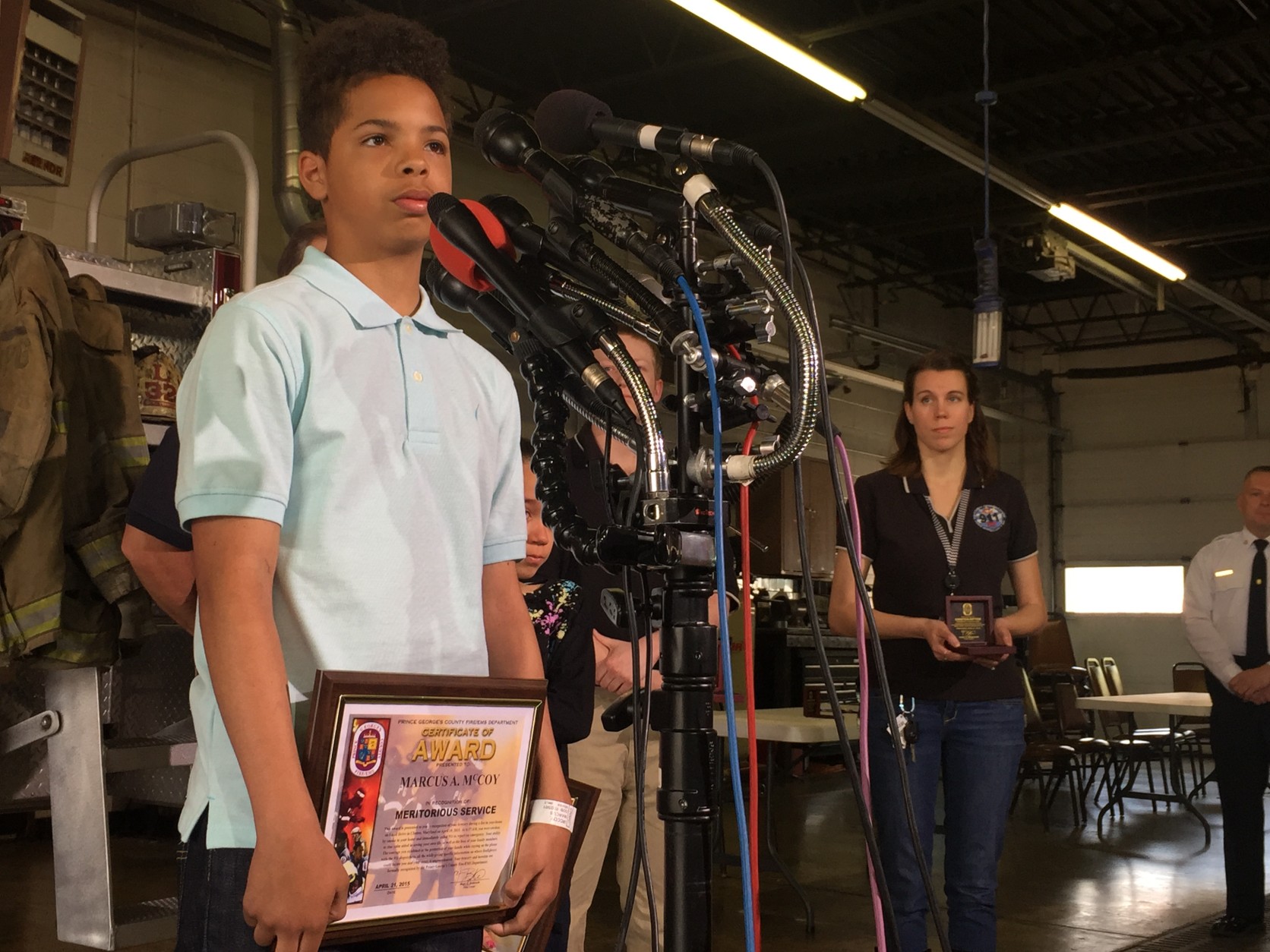 Marcus McCoy thanks first responders for saving him and his sister. (WTOP/Andrew Mollenbeck)