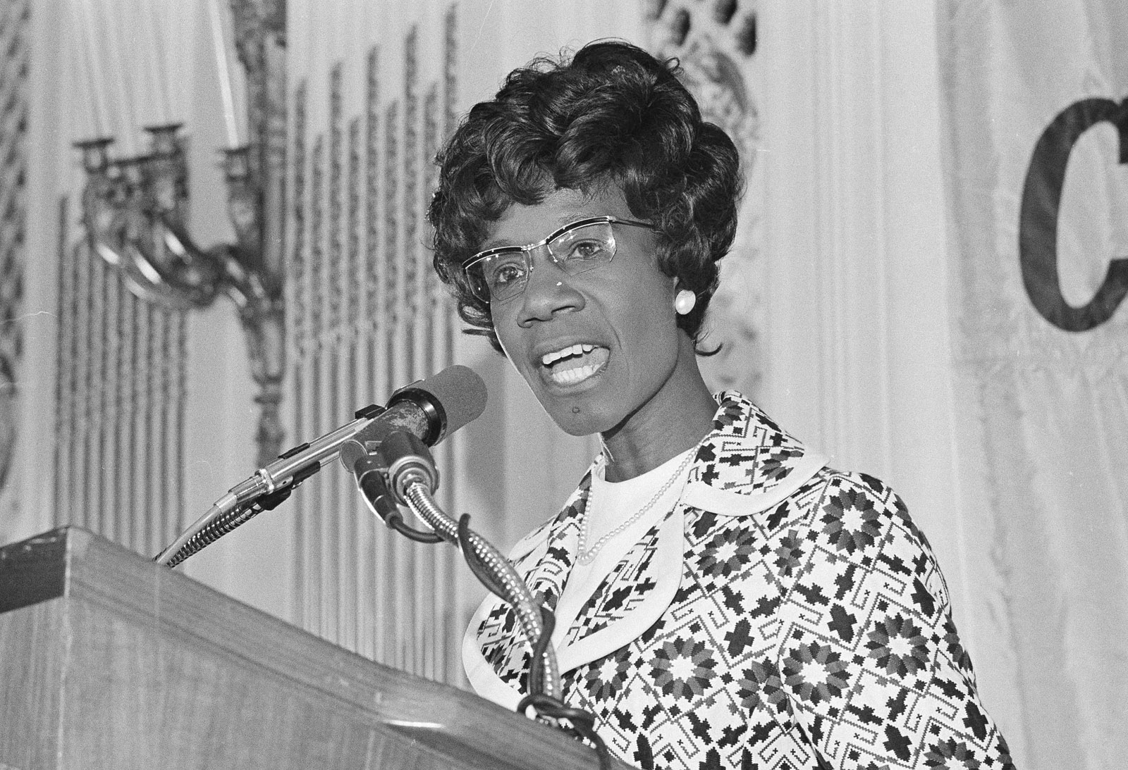 Shirley Chisholm, Democratic Congresswoman seeking the nomination for president, makes a point during a speech in San Francisco on Tuesday, May 16, 1972.   Under close guard from the secret service, Mrs. Chisholm was addressing the Commonwealth Club luncheon where she asked "How many more assassinations..before we realize the need to control weapons."   (AP Photo/ Richard Drew)