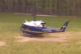 An Air Force helicopter experiencing mechanical troubles makes an emergency  landing on a field next to William Ramsay Elementary School in Alexandria Thursday morning. (Alexandria City Public Schools)