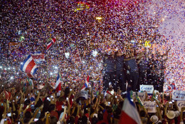 Members of Costa Rica’s national soccer team are greeted by fans, at their homecoming celebration in honor of the team's World Cup showing, in San Jose, Costa Rica, Tuesday, July 8, 2014. Costa Rica made it to the quarter-finals of the World Cup, only to be ousted by the Netherlands in a penalty shootout. (AP Photo/Esteban Felix)