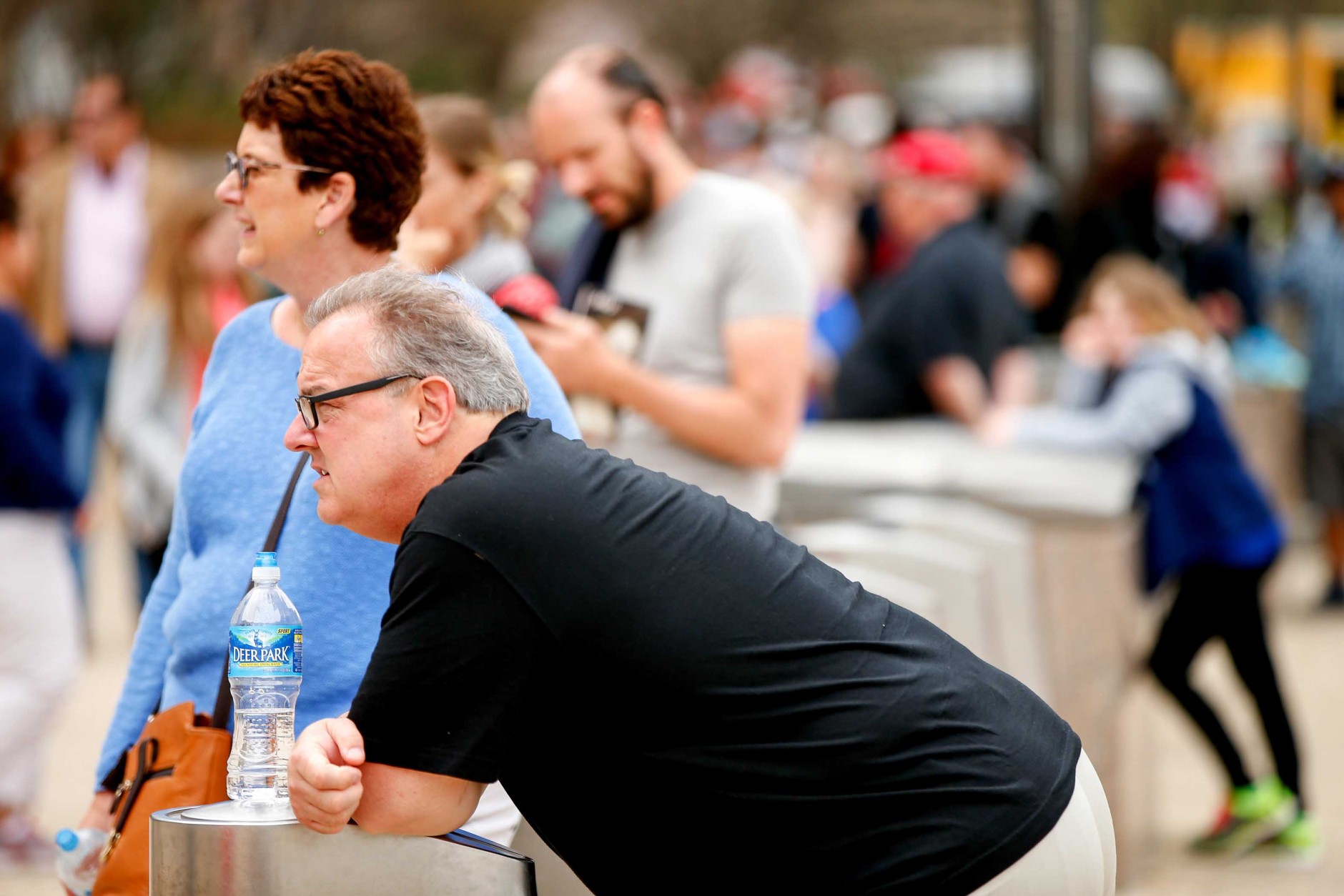 Michael and Julie Krieger of Poughkeepsie, N.Y. wait outside the Smithsonian's National Air and Space Museum for it to reopen after widespread power outages cause many of the buildings along the National Mall in Washington to shut down temporarily, Tuesday, April 7, 2015. Widespread power outages affected the White House, State Department, Capitol and other sites across Washington and its suburbs Tuesday afternoon — all because of an explosion at a power plant in southern Maryland, an official said.  (AP Photo/Andrew Harnik)