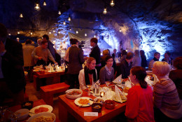 Customers having dinner at Muru Pop Down -restaurant at Tytyri mine in Lohja, Finland on Monday Sept. 10 2012. The award-winning chef, Niklas Ekblom, is opening a new restaurant in Finland that turns the idea of "pop-up" eateries upside-down: it's located 80 meters (260 feet) underground. Discerning food lovers are being served salted salmon, veal tenderloin snails cooked in Pernod, and apple crumble in the "pop-down" restaurant in a limestone mine in the small, southern town of Lohja, 60 kilometers (40 miles) west of Helsinki. A four-course evening meal costs 128 euro ($160), including drinks and transportation down to the mine and back up. (AP Photo/Lehtikuva, Antti Aimo-Koivisto)  FINLAND OUT