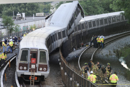District of Columbia Fire and Emergency workers at the site of a rush-hour collision between two Metro transit trains in northeast Washington, D.C. Monday, June 22, 2009. (AP Photo/Pablo Martinez Monsivais)