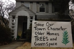This is Deborah Vollmer's home and a homemade sign she had placed in the front yard relating to her legal fight. The home was built in 1928.  (WTOP/Michelle Basch)
