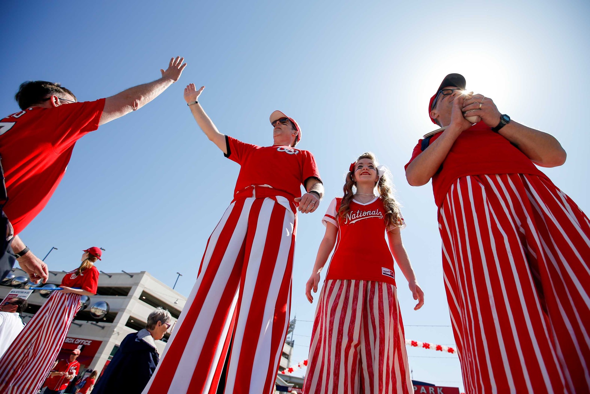 Entertainers on stilts welcome fans to the stadium before a baseball game between the Washington Nationals and the New York Mets on opening day at Nationals Park, Monday, April 6, 2015, in Washington. (AP Photo/Andrew Harnik)