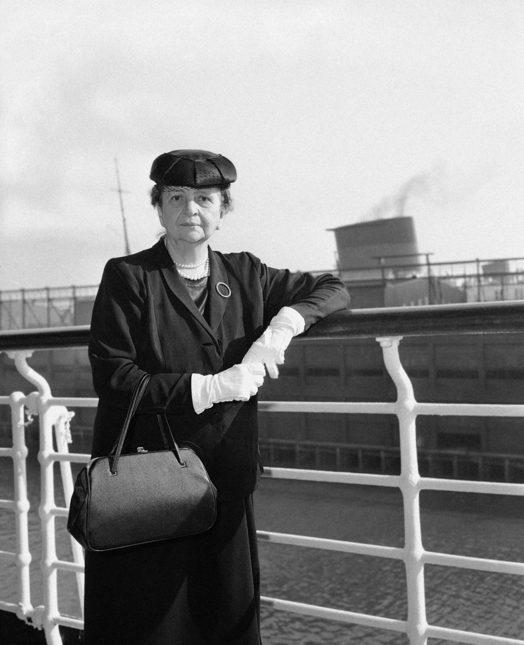 Frances Perkins, who celebrated her 70th birthday last April, is about to step out of a Washington career that began in 1933. She has prepared her formal resignation as one of the three members of the Civil Service Commission. She served as Secretary of Labor from March 1933 to June 1945. At left, she is shown about the time when she returned from an International Labor Organization Conference at Geneva in 1952. (AP Photo)
