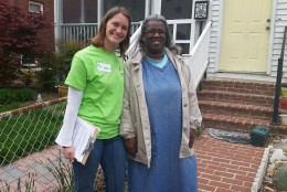 Here, Michelle Cruickshank (left) of Rebuilding Together Alexandria poses with Frances Brown outside her home. Brown needed work done on her home that she otherwise couldn't afford. (WTOP/Kathy Stewart)