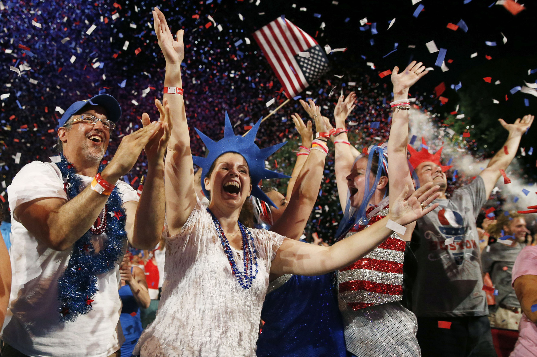 A crowd celebrates during the finale of the Boston Pops Fourth of July Concert at the Hatch Shell in Boston, Thursday, July 4, 2013. (AP Photo/Michael Dwyer)