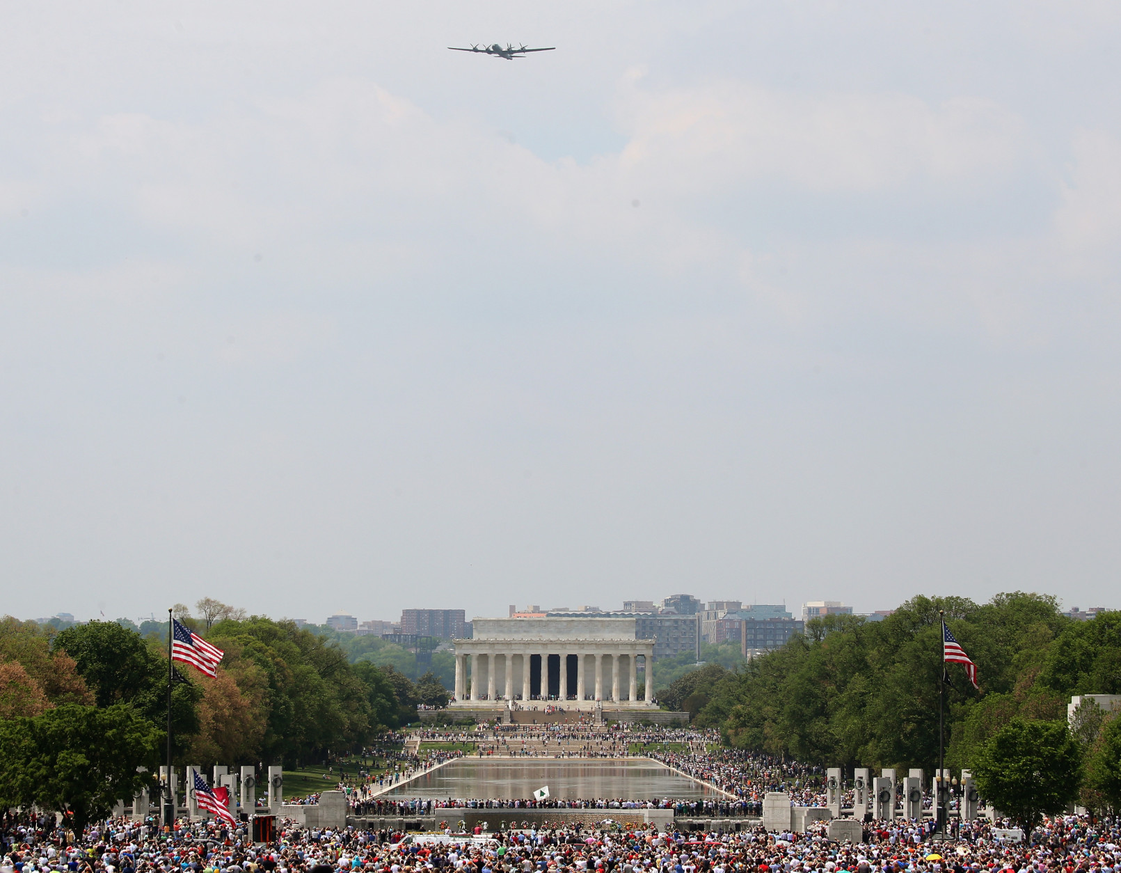 WASHINGTON, DC - MAY 08: A vintage World War II B29 bomber flies over the Lincoln and WWII Memorials May 8, 2015 in Washington, DC. Fifty six vintage war planes took part in a flyover at the WWII memorial for the 70th anniversary Victory in Europe celebration. (Photo by Mark Wilson/Getty Images)