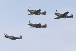 WASHINGTON, DC - MAY 08:  Vintage World War II  war planes fly in formation down the National Mall May 8, 2015 in Washington, DC. Fifty six vintage war planes took part in a flyover near the WWII memorial for the 70th anniversary Victory in Europe celebration.  (Photo by Mark Wilson/Getty Images)
