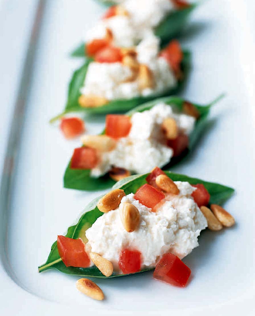 ** FOR USE WITH AP WEEKLY FEATURES **  Basil Leaves Stuffed With Chevre and Pine Nuts would make a light lunch for which the only cooking needed is to toast pine nuts. The recipe is from Food &amp; Wine magazine's "Food &amp; Wine Fast." (AP Photo/Larry Crowe)