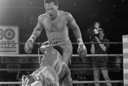Challenger Mike Weaver falls towards WBA Heavyweight Champion Pinklon Thomas during first round of their 12-round title fight at the Riviera Hotel in Las Vegas, Nev., June 15, 1985.  Weaver was later knocked out in the eighth.  (AP Photo/Doug Pizac)