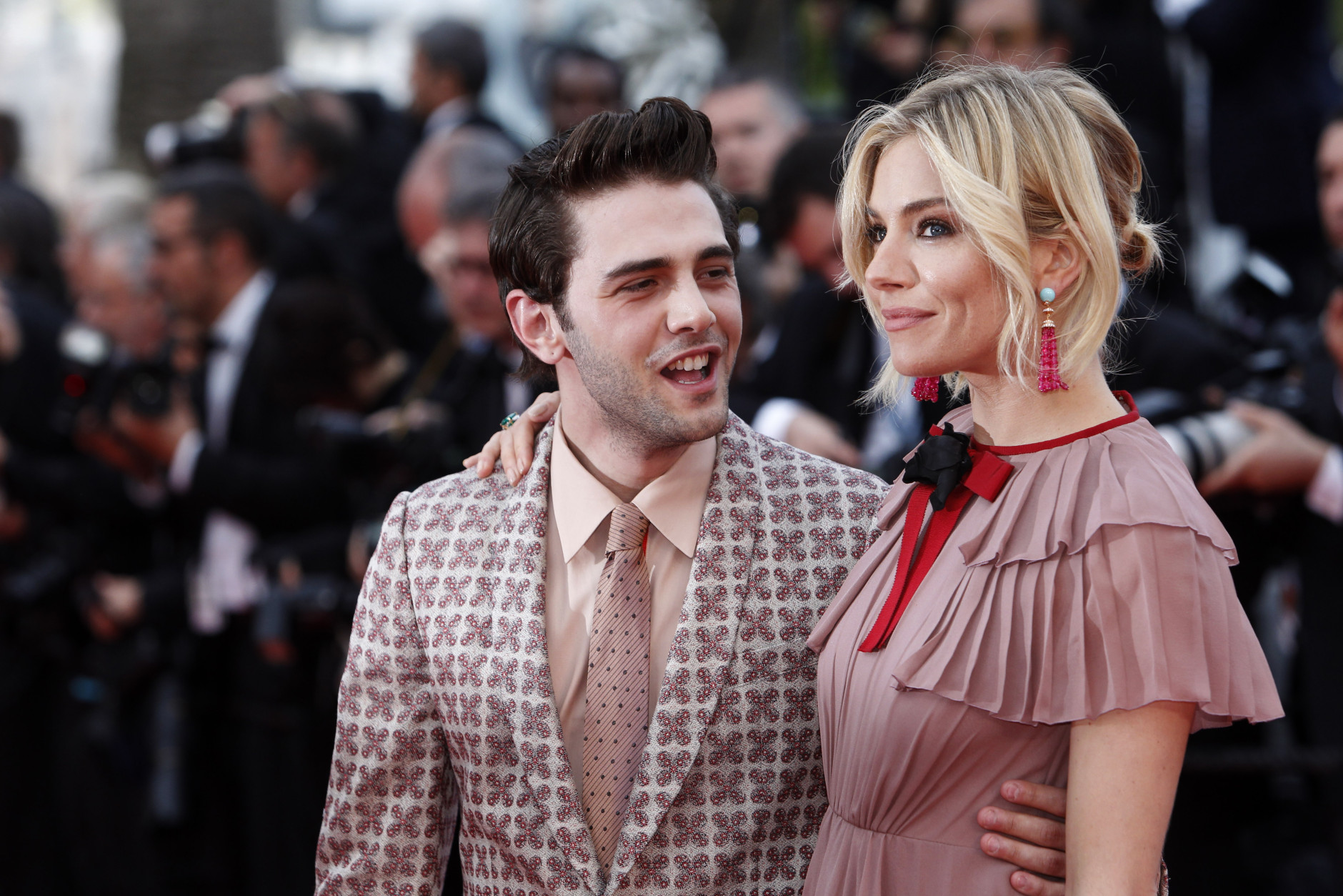 Jury members Sienna Miller, right, and Xavier Dolan pose for photographers upon arrival for the screening of the film Macbeth at the 68th international film festival, Cannes, southern France, Saturday, May 23, 2015. (AP Photo/Lionel Cironneau)