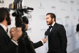 Jake Gyllenhaal speaks to reporters on arrival for the amfAR Cinema Against AIDS benefit at the Hotel du Cap-Eden-Roc, during the 68th Cannes international film festival, Cap d'Antibes, southern France, Thursday, May 21, 2015. (AP Photo/Thibault Camus)