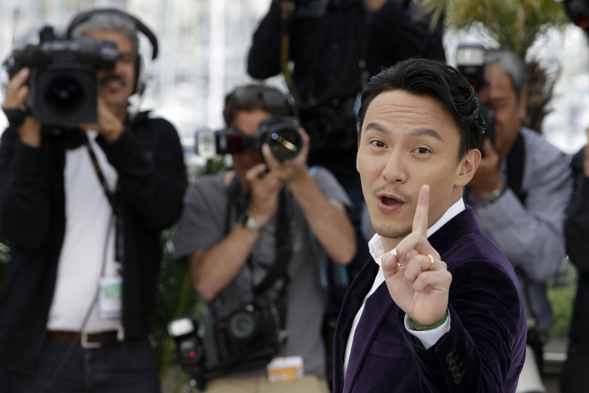 Actor Chang Chen poses for photographers during a photo call for the film Nie Yinniang (The Assassin), at the 68th international film festival, Cannes, southern France, Thursday, May 21, 2015. (AP Photo/Lionel Cironneau)