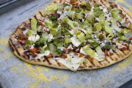 This July 22, 2013 photo taken in Concord, N.H., shows a recipe for grilled BLT pizza with summer tomato-basil sauce. (AP Photo/Matthew Mead)