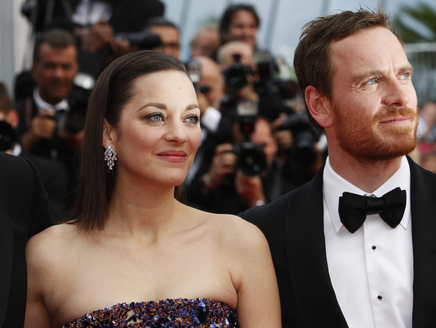 Actors Marion Cotillard and Michael Fassbender pose for photographers upon arrival for the screening of the film Macbeth at the 68th international film festival, Cannes, southern France, Saturday, May 23, 2015. (AP Photo/Lionel Cironneau)