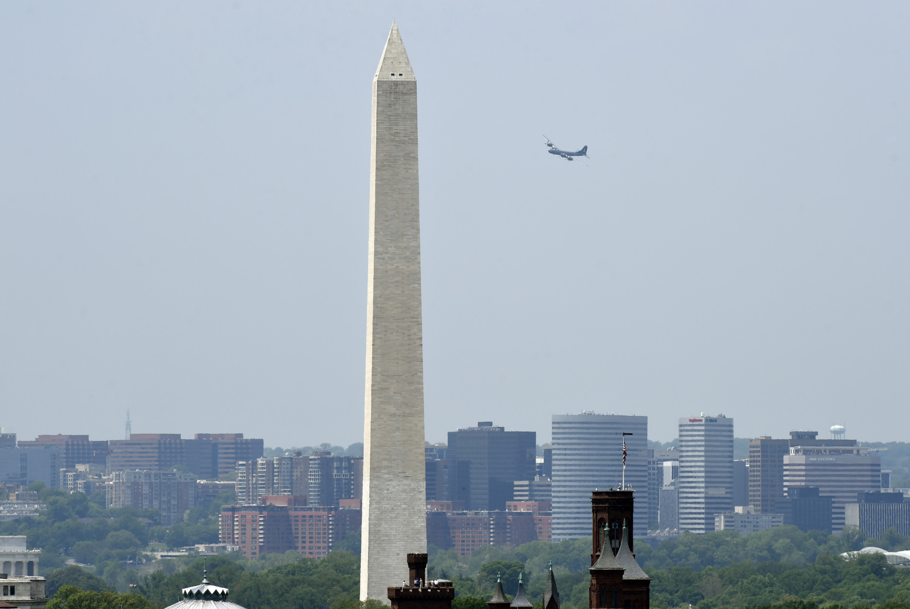 A B-29 Superfortress named "Fifi" and the plane that dropped the atomic bomb, flies over the skies of Washington, Friday, May 8, 2015. Dozens of vintage military aircraft from World War II made the flight over the nation's capital to mark the 70th anniversary of Victory in Europe Day. (AP Photo/Susan Walsh)