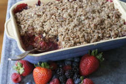 This May 5, 2014 photo shows summer crisp with pecan streusel topping in Concord, N.H. The addition of orange liqueur is optional for the dish, but it can make big difference in the summer dessert. (AP Photo/Matthew Mead)