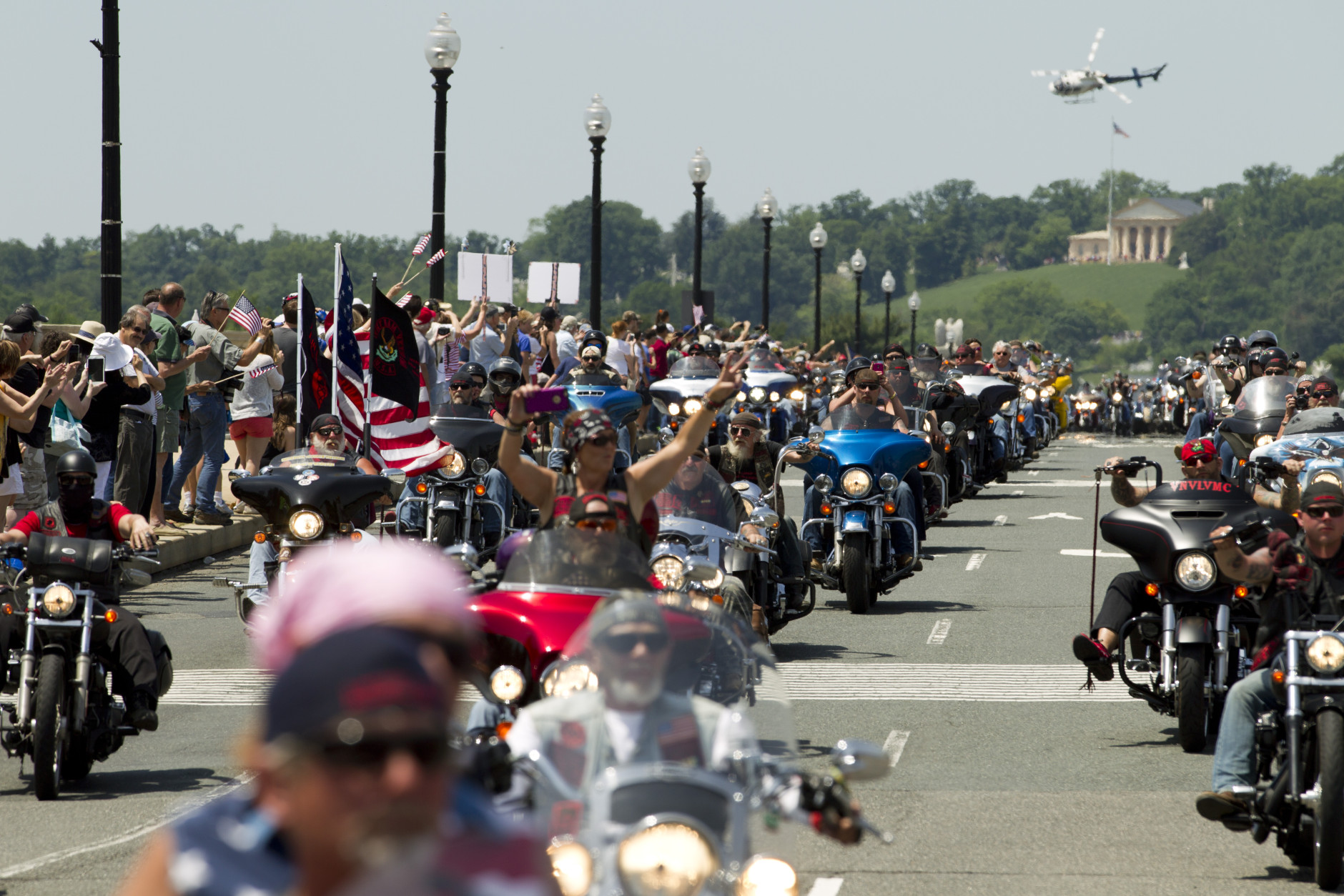 Participants in the Rolling Thunder annual motorcycle rally ride past Arlington Memorial Bridge  during the annual Rolling Thunder parade ahead of Memorial Day in Washington, Sunday, May 24, 2015.  (AP Photo/Jose Luis Magana)
