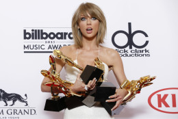 Taylor Swift poses in the press room with the awards for top Billboard 200 album for 1989," top female artist, chart achievement, top artist, top Billboard 200 artist, top hot 100 artist, top digital song artist, and top streaming song (video) for Shake It Off at the Billboard Music Awards at the MGM Grand Garden Arena on Sunday, May 17, 2015, in Las Vegas. (Photo by Eric Jamison/Invision/AP)