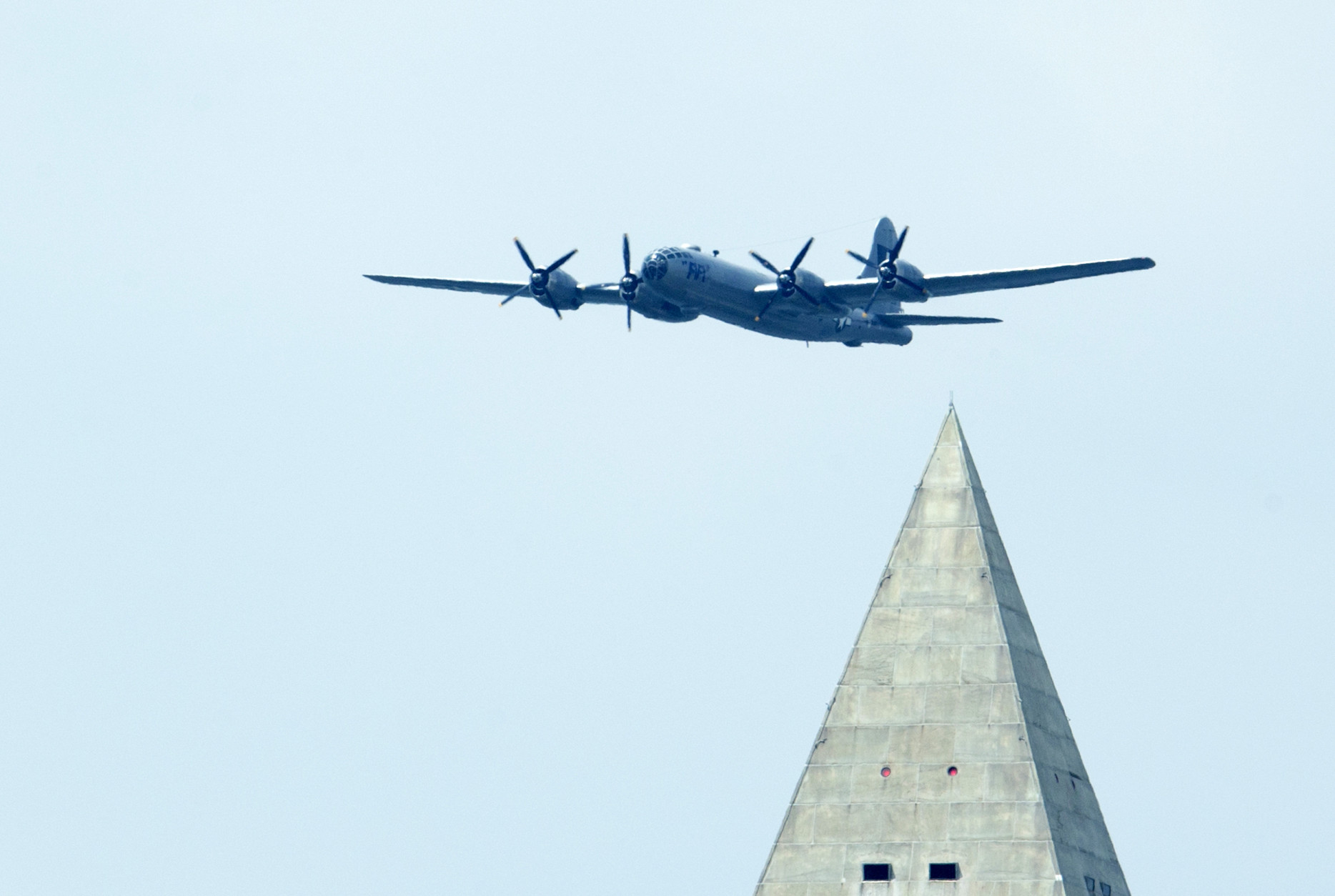 A Boeing B-29 Superfortress flies near the Washington Monument in Washington, Friday, May 8, 2015, during a flyover of World War II vintage aircrafts, marking the 70th anniversary of the end of the war in Europe on May 8, 1945, and commemorate the Allied victory in Europe during World War II. (AP Photo/Manuel Balce Ceneta)