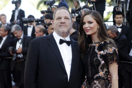 Producer Harvey Weinstein, left, and his wife Georgina Chapman pose for photographers upon arrival for the screening of the film The Little Prince at the 68th international film festival, Cannes, southern France, Friday, May 22, 2015. (AP Photo/Lionel Cironneau)