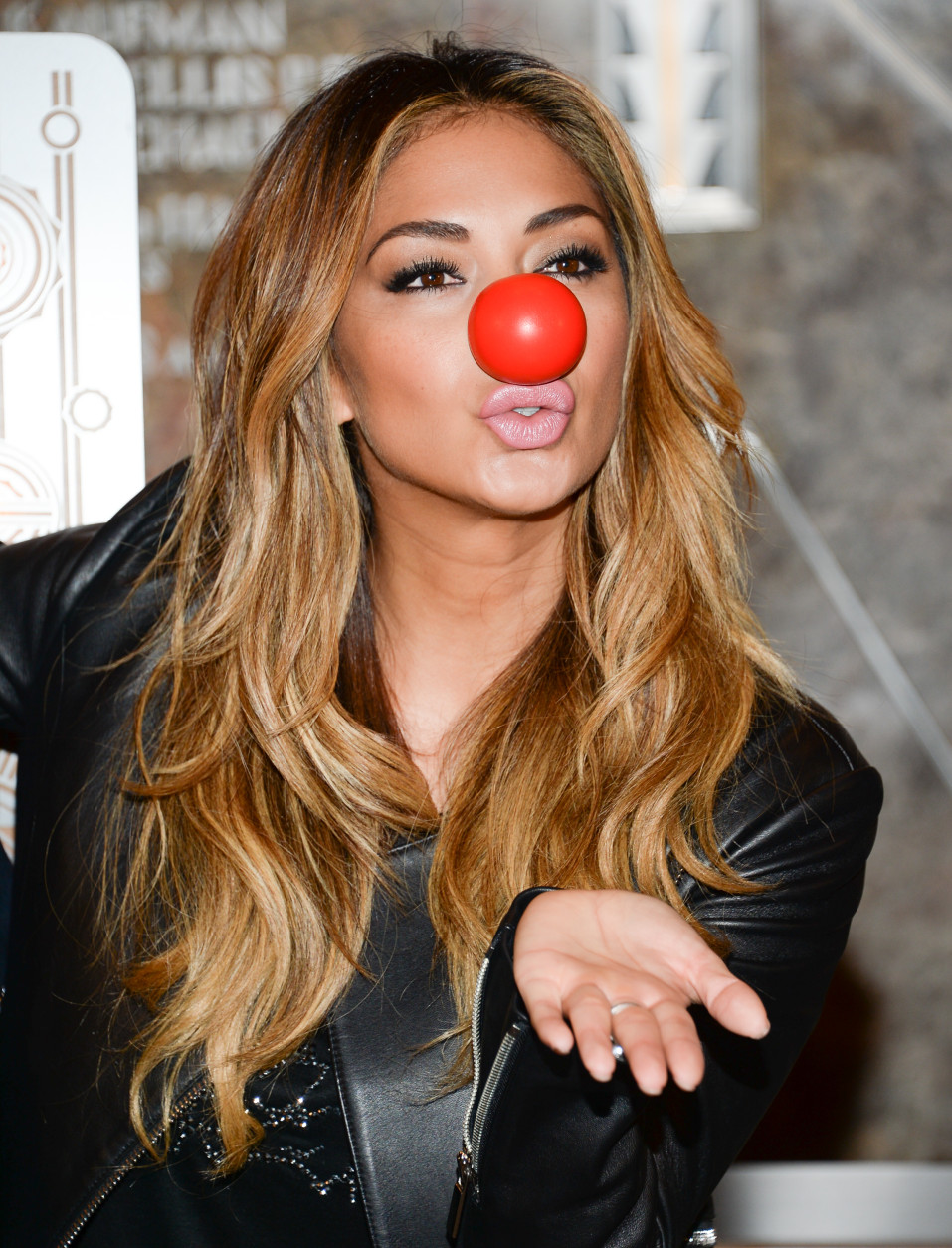 Singer Nicole Scherzinger attends the Empire State Building lighting in honor of NBC's Red Nose Day entertainment charity event on Thursday, May 21, 2015, in New York. (Photo by Evan Agostini/Invision/AP)