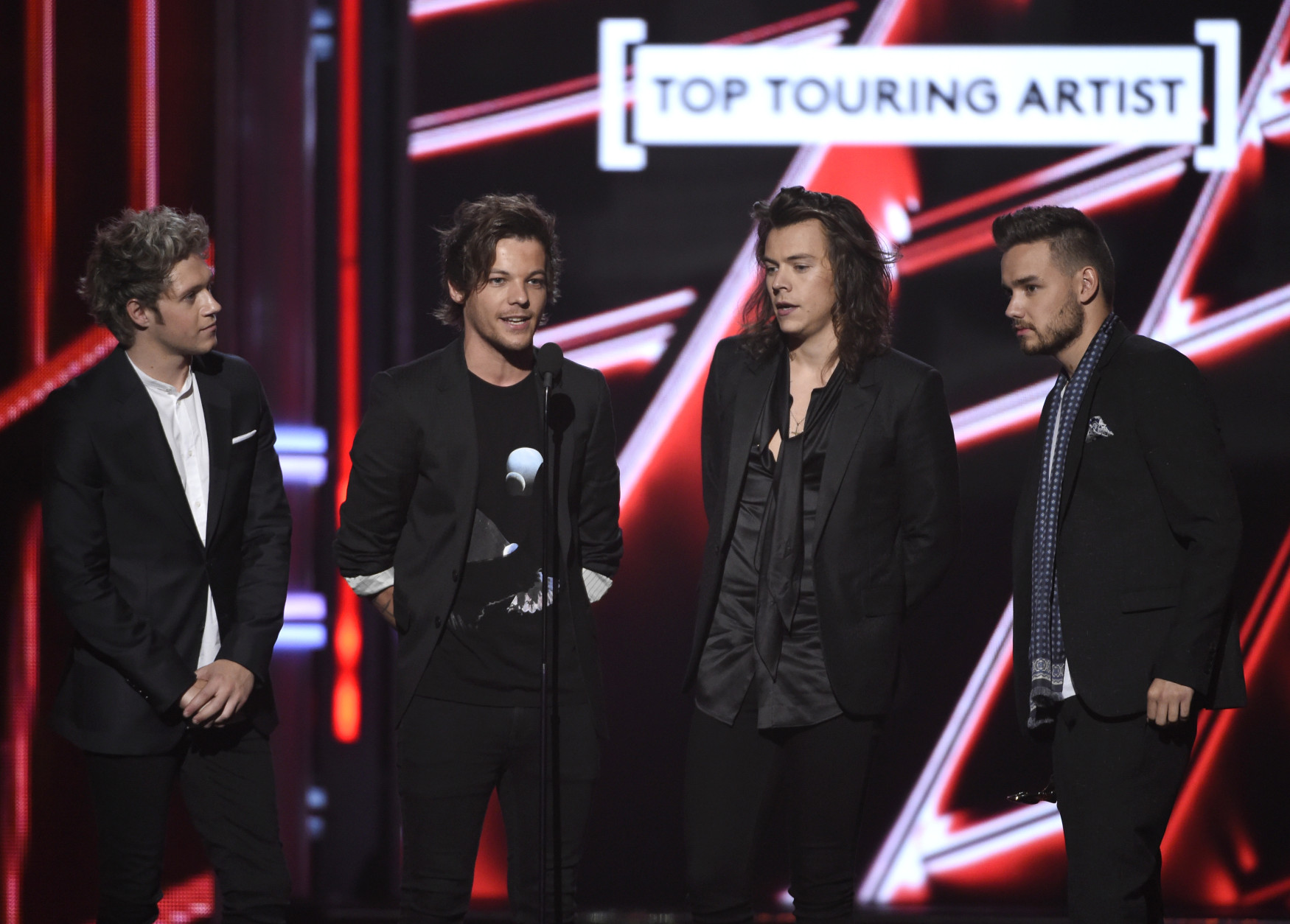 Niall Horan, from left, Louis Tomlinson, Harry Styles, and Liam Payne of One Direction accept the award for top touring artist at the Billboard Music Awards at the MGM Grand Garden Arena on Sunday, May 17, 2015, in Las Vegas. (Photo by Chris Pizzello/Invision/AP)