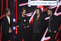 Niall Horan, from left, Louis Tomlinson, Harry Styles, and Liam Payne of One Direction accept the award for top touring artist at the Billboard Music Awards at the MGM Grand Garden Arena on Sunday, May 17, 2015, in Las Vegas. (Photo by Chris Pizzello/Invision/AP)