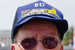 WWII Veteran Bill Hare, 89, of Stewartstown, Pa., wears a B-17 hat at the World War II Memorial in Washington, Friday, May 8, 2015, during a flyover of WWII era aircraft in honor of the 70th anniversary of Victory in Europe Day (VE Day). The Flyover above the National Mall featured historically sequenced formations of more than 50 vintage World War II aircraft. Hare was an engineer who flew on B-17's during the war, and says he enjoyed being in the military. (AP Photo/Jacquelyn Martin)